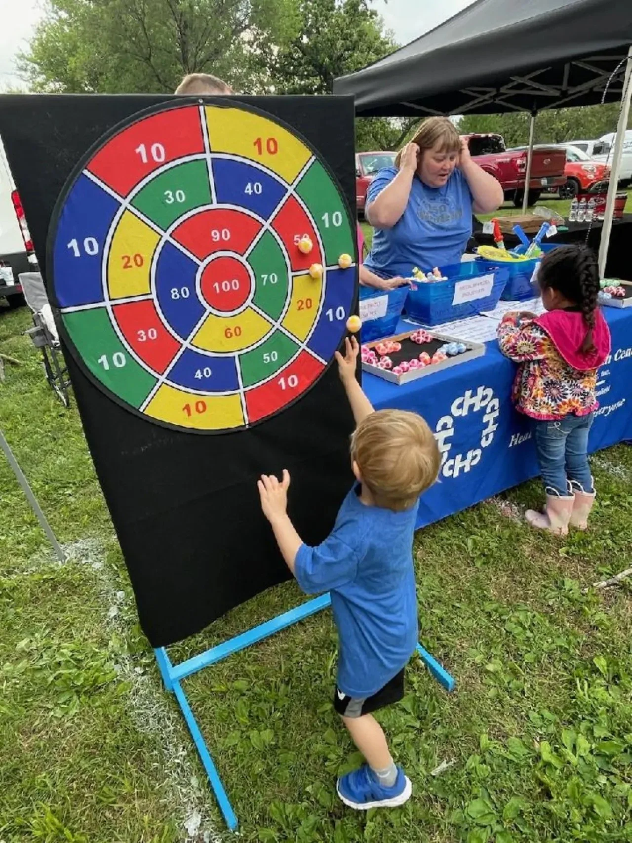 Pharmacist Kayla Dutton staffing the CHC booth at a community event.