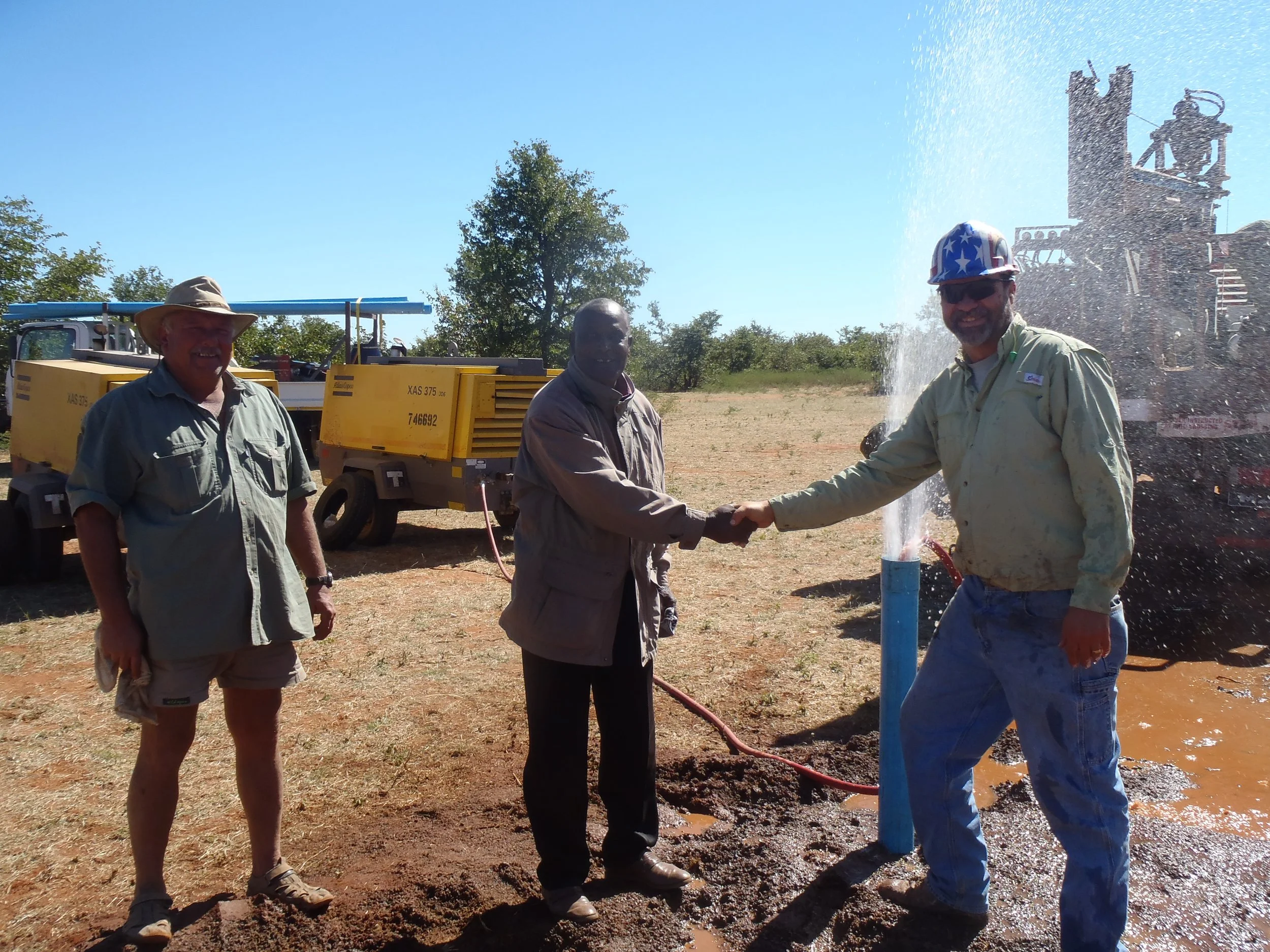 Celebration as the hope of water is realized.JPG
