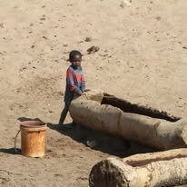 Little boy in a dry river bed.jpg