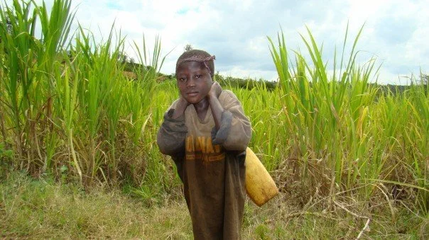 Girl with water Rwanda.jpg