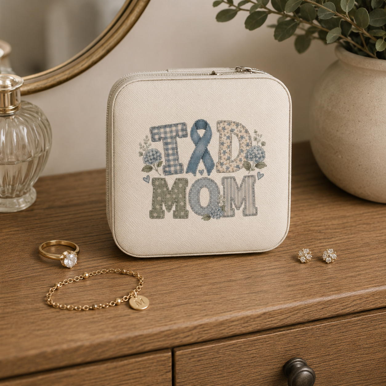 • Travel jewelry case with secure zipper closure   • “T1D MOM” lid design with blue ribbon and floral accents