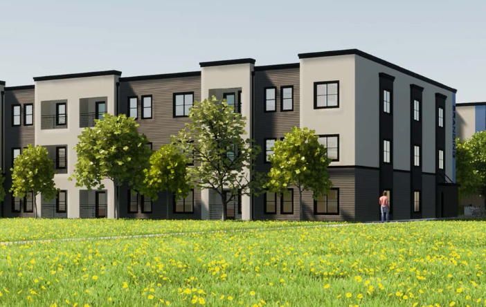 Modern apartment building with three trees in front and a grassy area with yellow flowers.