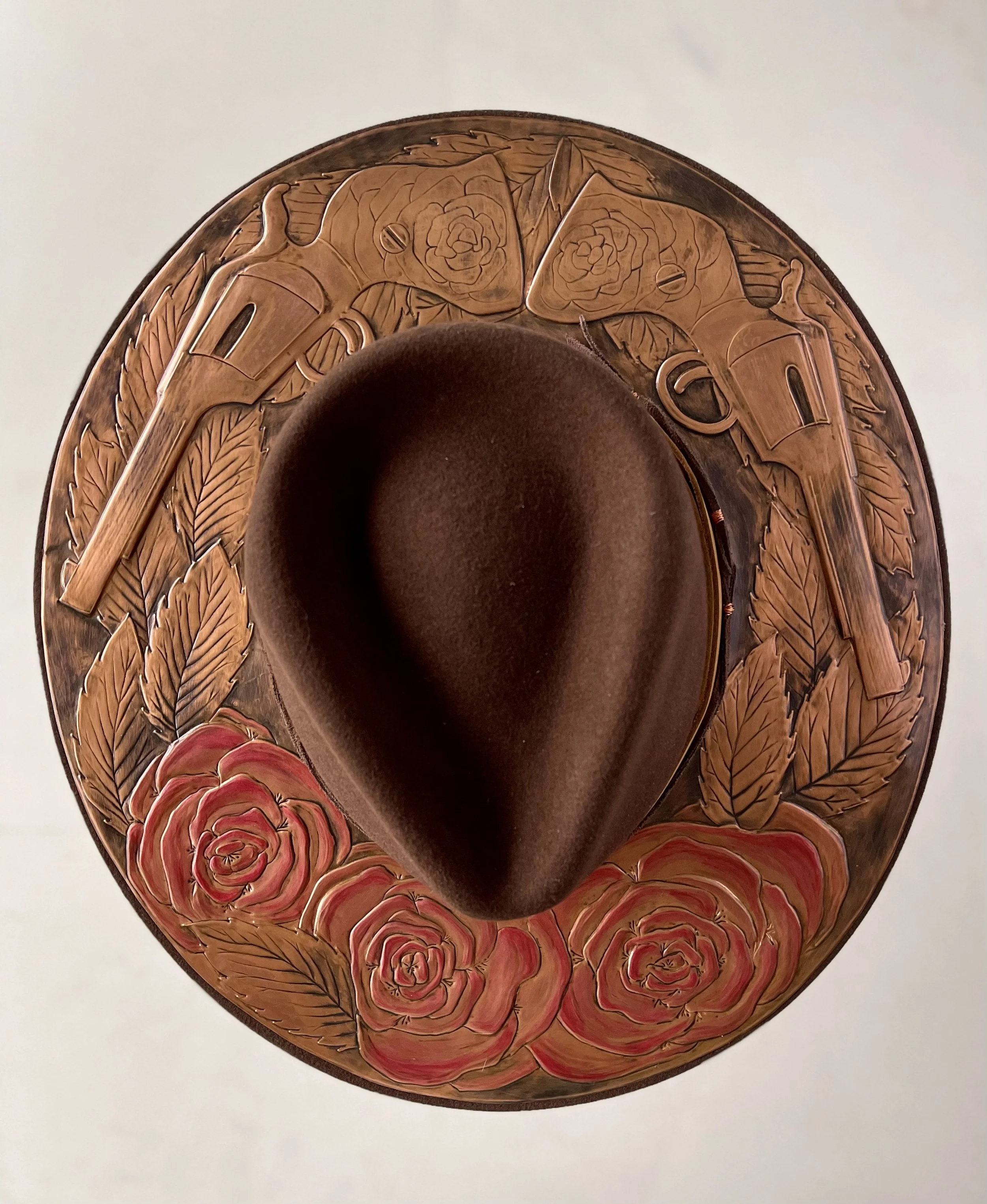 Erin Stelmaschuk Biegel artist, custom copper adorned cowboy hat, custom western hat, western art, cowboy art, guns and roses, keepsake