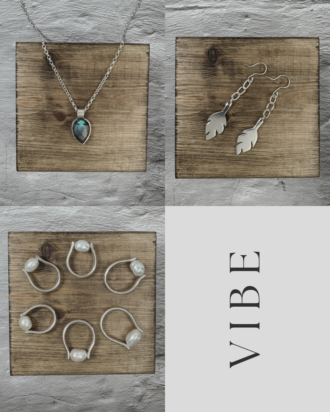 Jewelry display with three sets of earrings and a necklace on wooden blocks, with the text 'VIBE' written vertically.