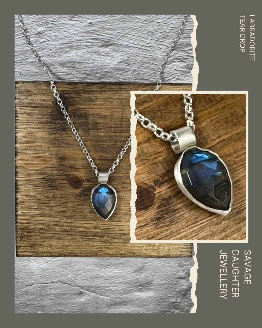 A silver necklace with a teardrop-shaped dark iridescent labradorite gemstone pendant hanging on a rustic wooden surface.