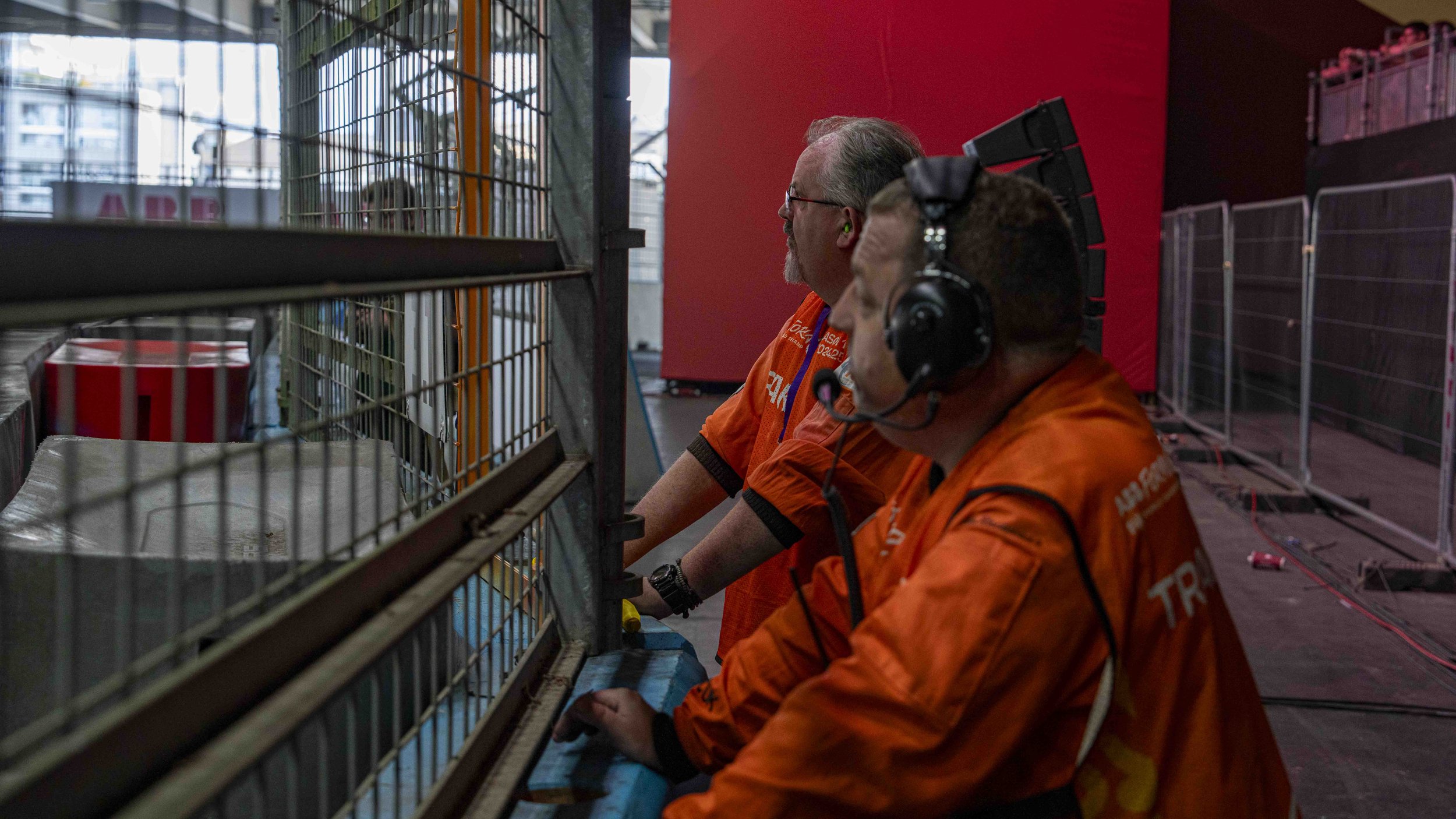 Marshalls, watching Formula E from behind the barriers.