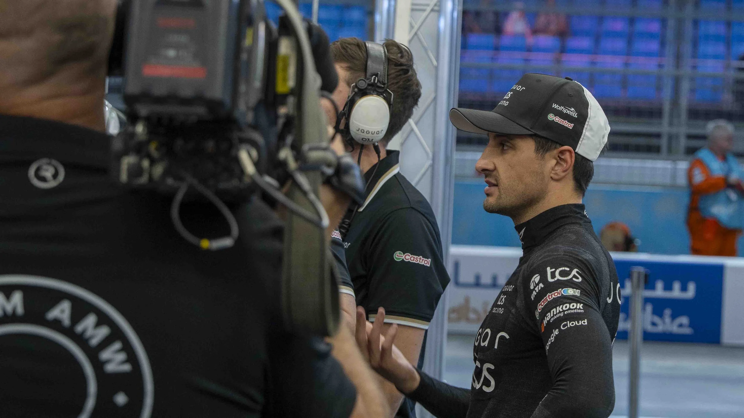 Mitch Evans in the garage running through strategy with the engineers