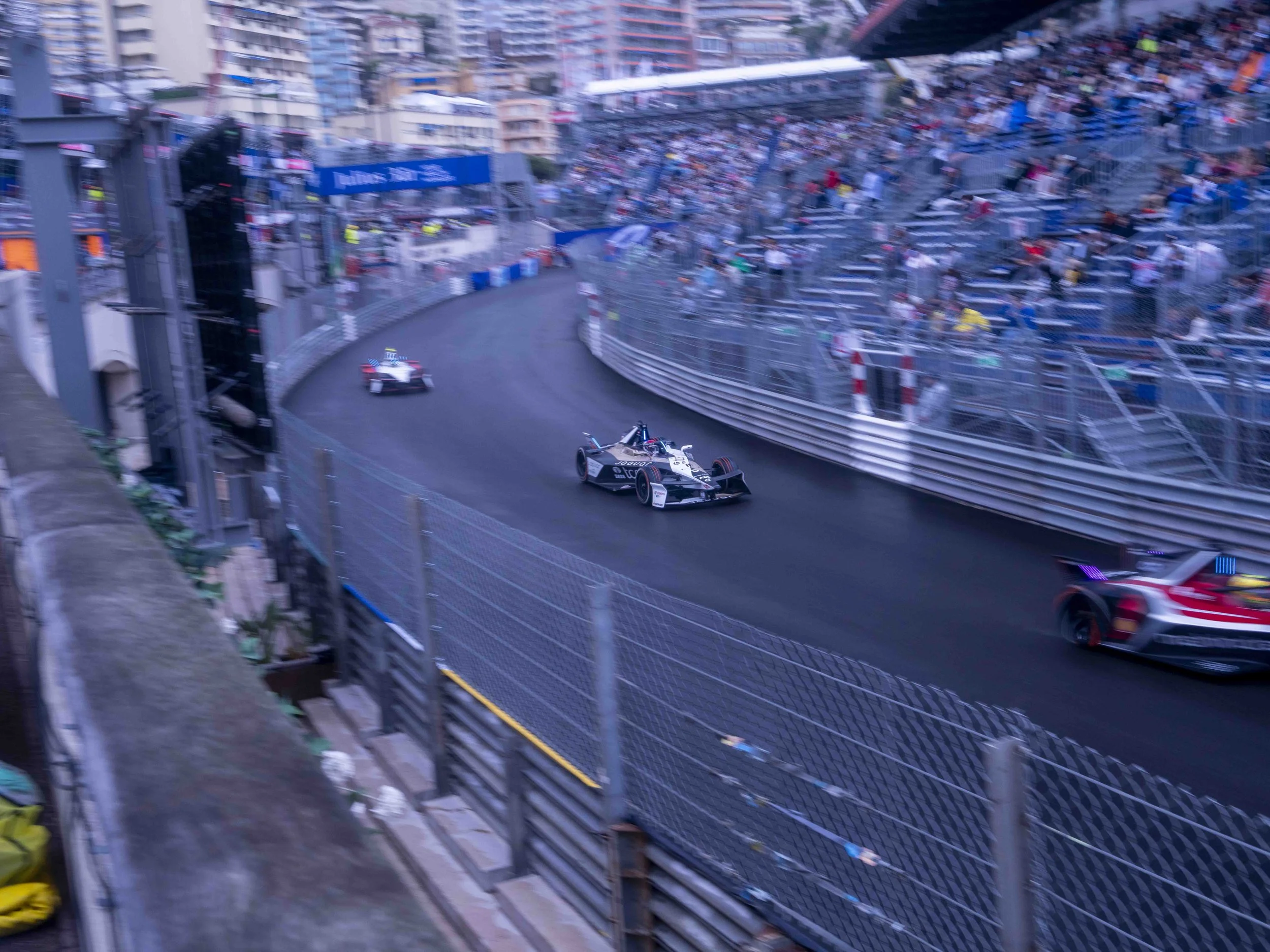 Formula E in Monaco and grandstands filled with spectators.