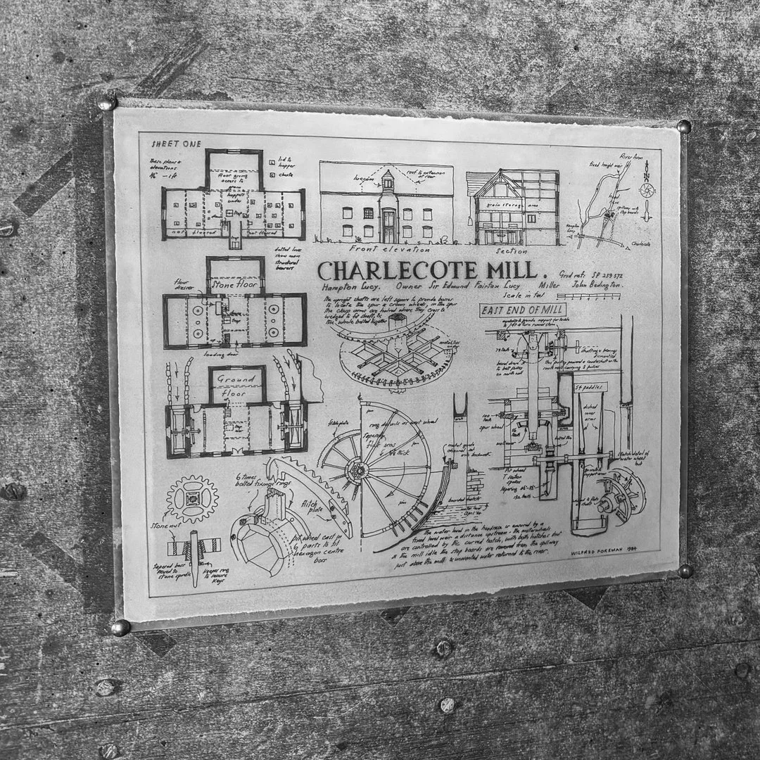 Architectural blueprint of the Charlocote Mill, showing floor plans and sections, with drawings of the front elevation, section, and detailed mill machinery diagrams.