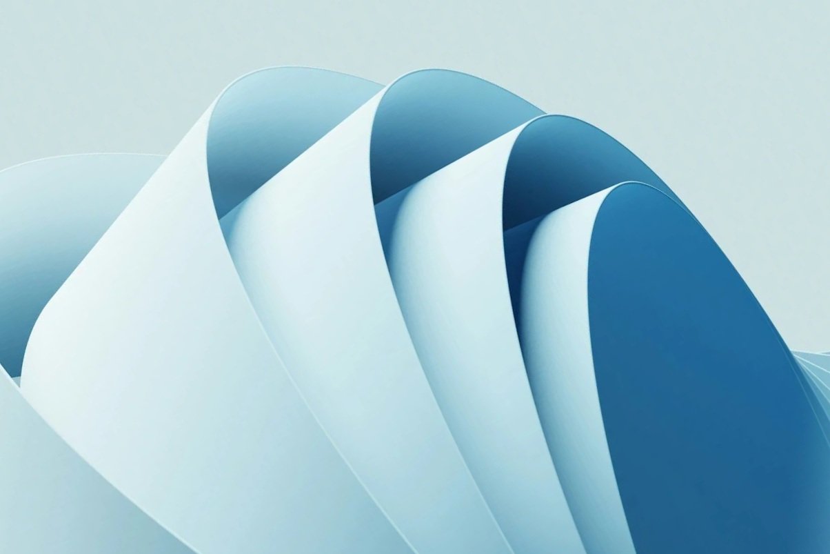 Abstract digital art featuring overlapping blue and white curved shapes creating a layered wave-like pattern.