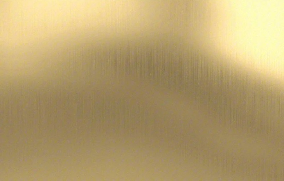 Blurred, golden-colored abstract background with vertical lines.