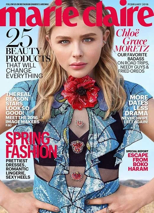 Front cover of Marie Claire magazine, February 2016 issue, featuring a young woman with blonde hair, wearing a colorful, floral-patterned jacket with ruffles, and a large red flower necklace. The cover highlights content about beauty products, spring