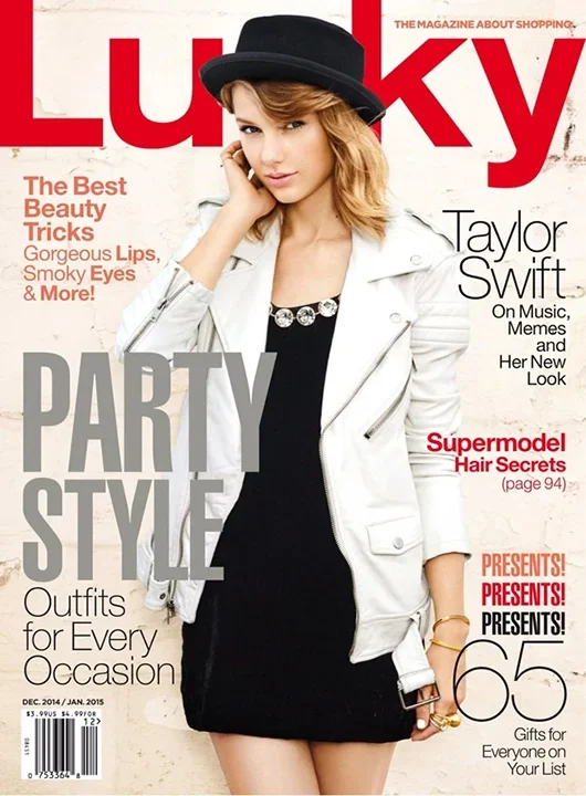 Woman with blonde hair wearing a white jacket, black dress, and black hat on the cover of Lucky magazine.