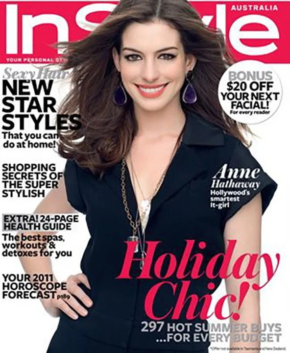 Magazine cover featuring a woman with long brown hair, wearing a dark blue outfit and purple earrings, smiling. The magazine is titled 'InStyle Australia,' and includes headlines about fashion, beauty, health, and horoscopes.