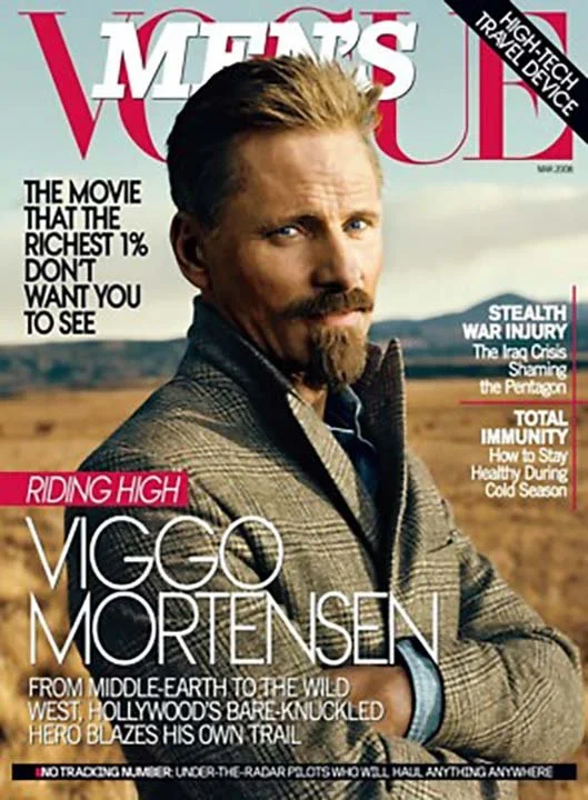 Magazine cover of Men's World featuring Viggo Mortensen in a rural landscape, with headlines about movies, health, and technology.