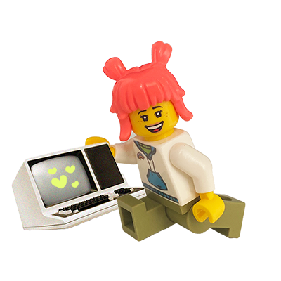 Lego figurine with pink hair sitting next to a small computer with a screen showing hearts.