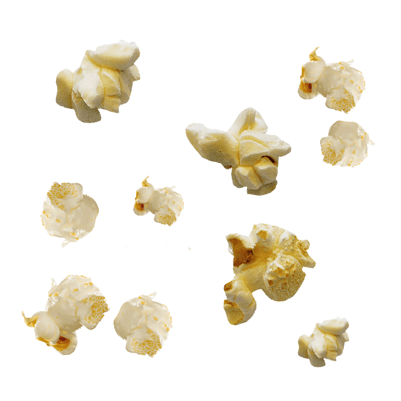 Multiple pieces of caramel popcorn scattered on a surface
