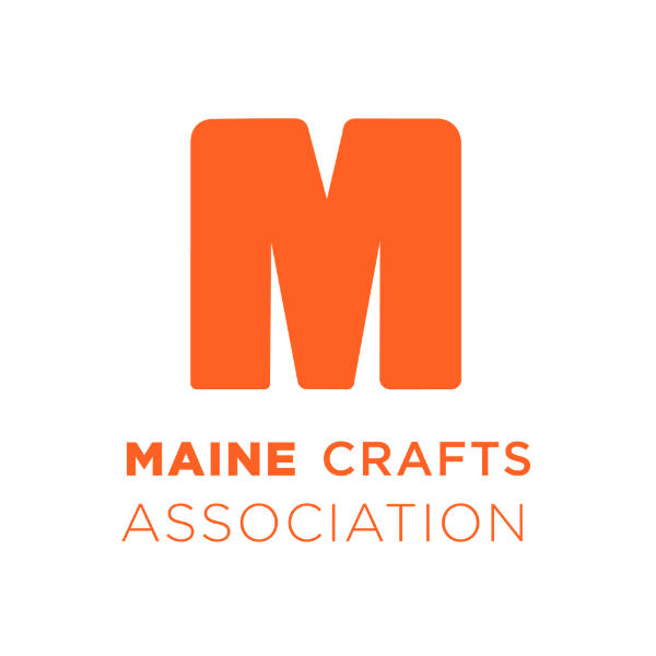 Logo of Maine Crafts Association with a large orange letter 'M' and orange text below reading 'MAINE CRAFTS ASSOCIATION.'