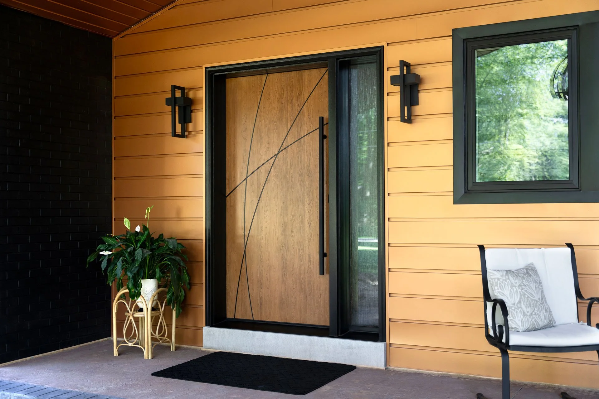 House with ProVia Signet Cherry Inscribed Entry Door with Waterfall Privacy Glass
