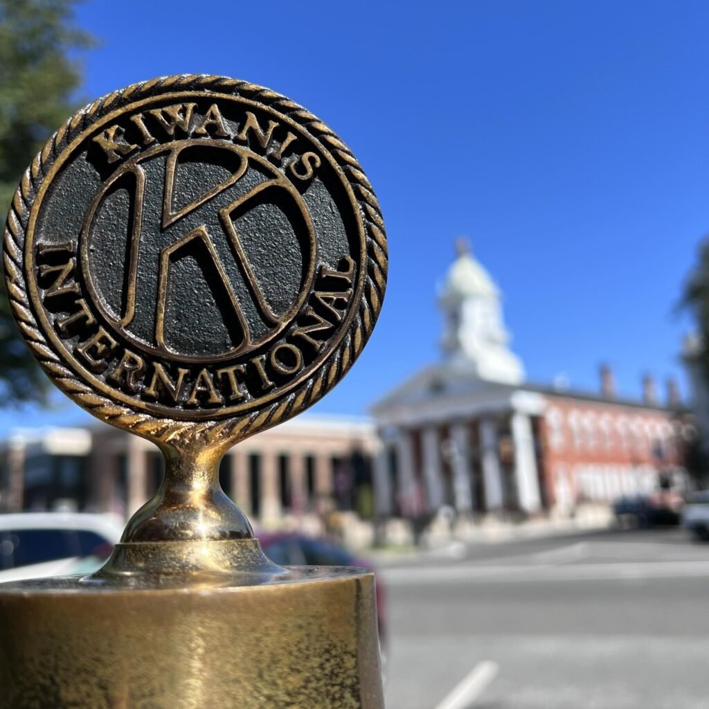 This is a photo of our Official Kiwanis Seal, set into a metal frame.