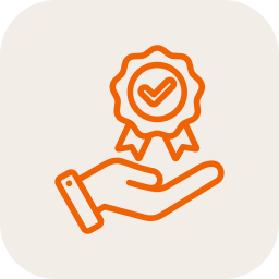 A hand holding a medal with a check mark in the center