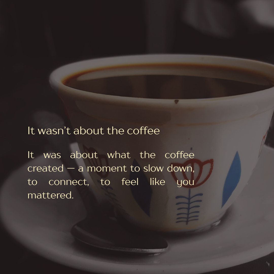 A cup of black coffee on a saucer with a spoon, accompanied by a quote about the meaning of coffee beyond just the beverage.