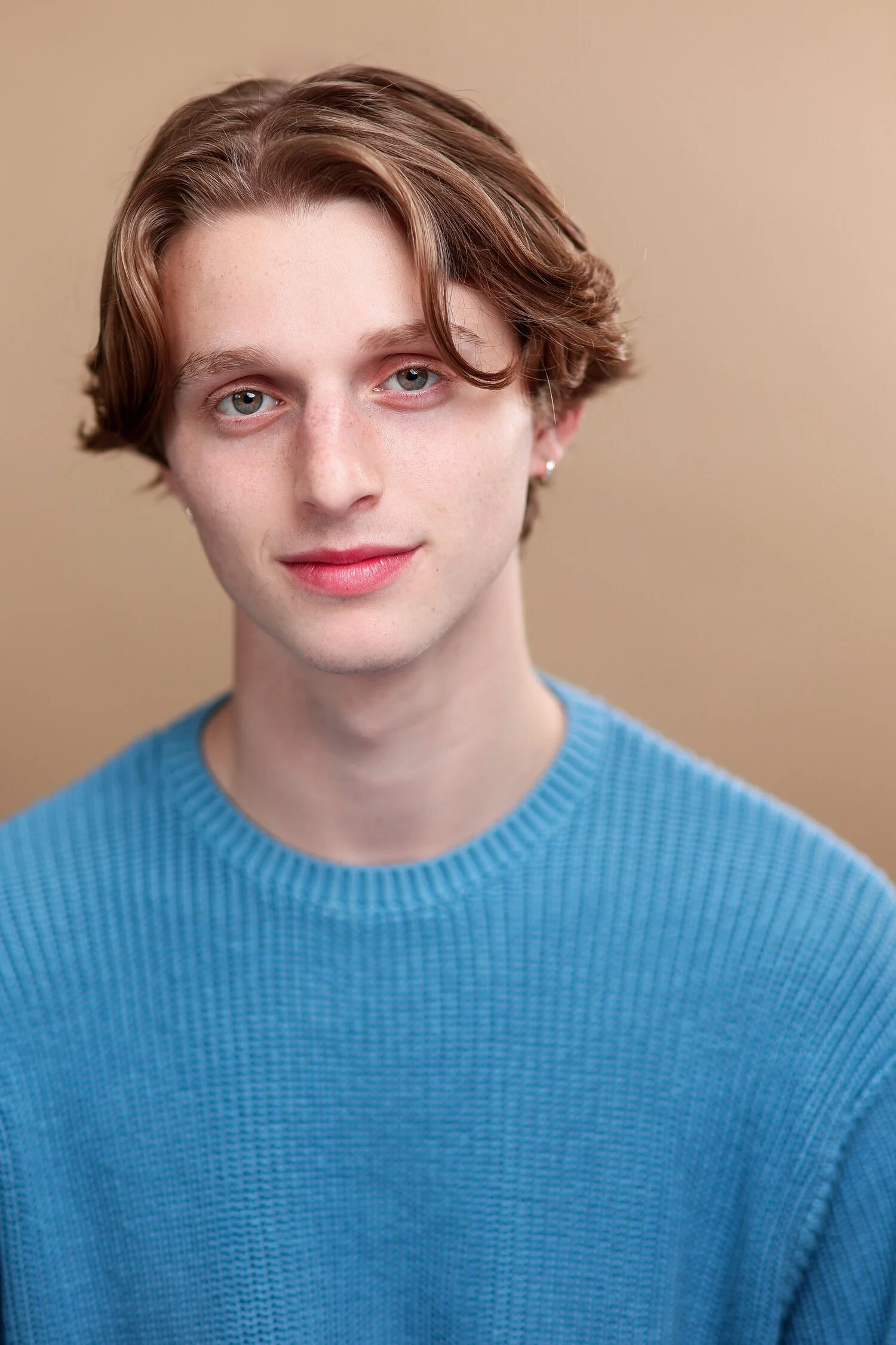 Headshot of Owen Boyce. He is wearing a light blue sweater.