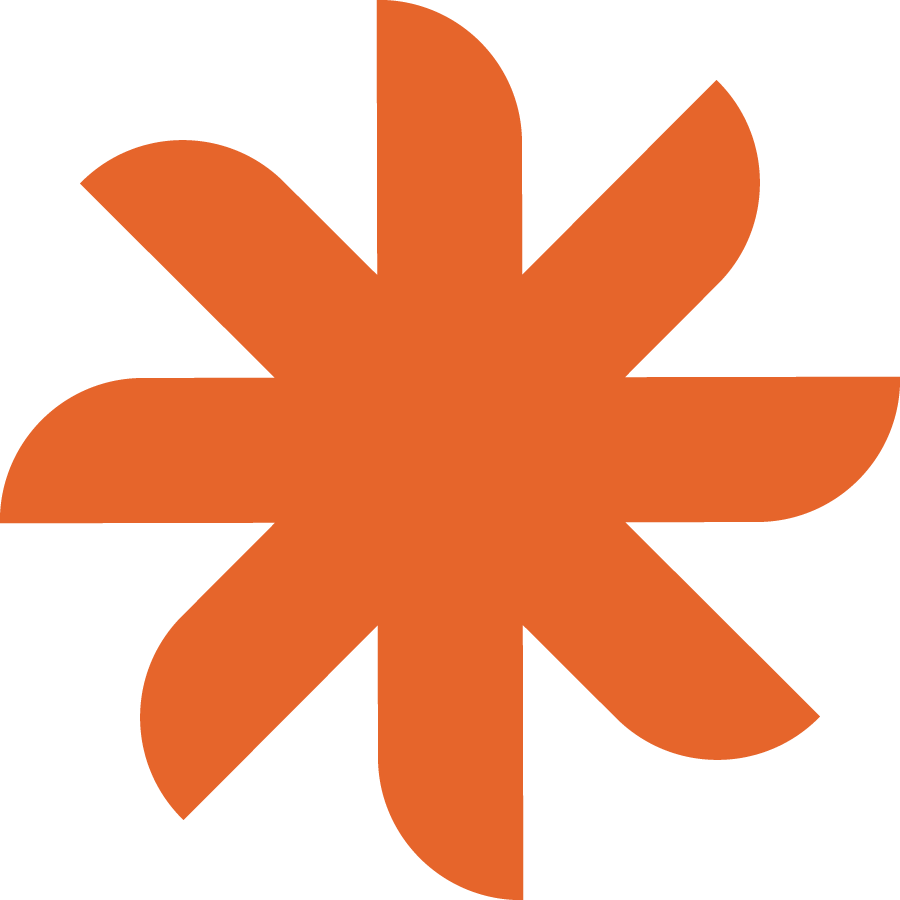 An abstract orange star-like shape with multiple pointed tips on a black background.