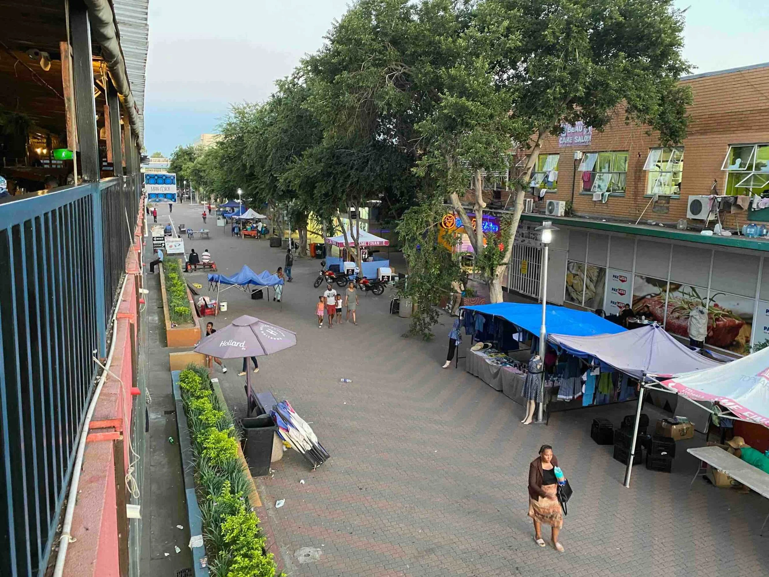 View from Main Deck bar onto Main Mall shopping street and market in Gaborone Botswana