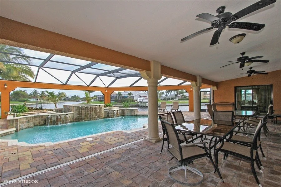 16_1930-SE-21st-Ter_79_Expansive-covered-screend-lanai-adjacent-to-pool-_Web.jpg
