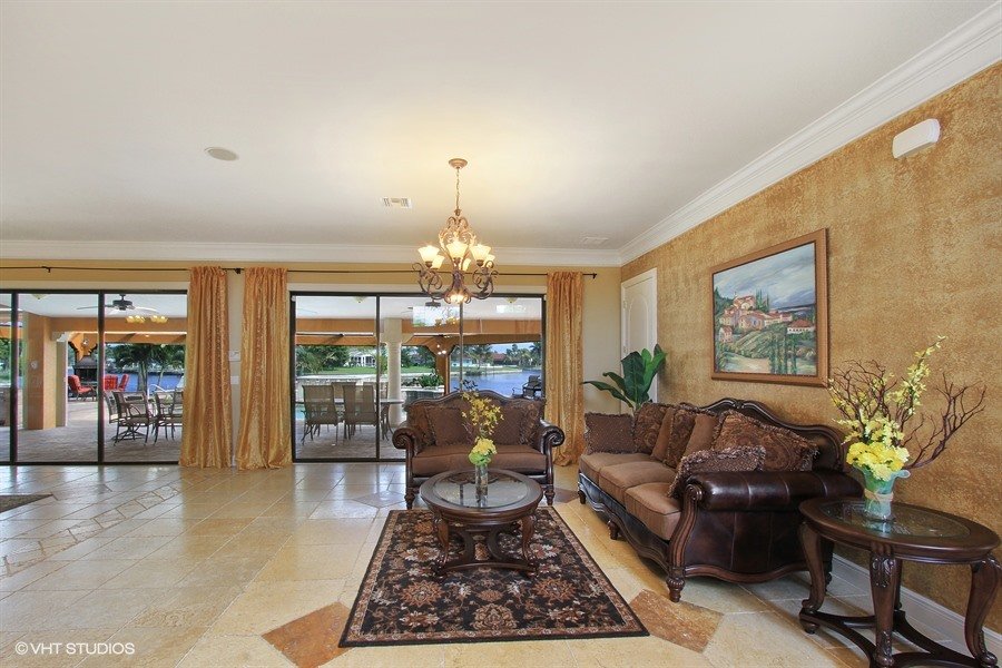 03_1930-SE-21st-Ter_1_Great-Room-Opens-to-Waterfront-Pool_Web.jpg