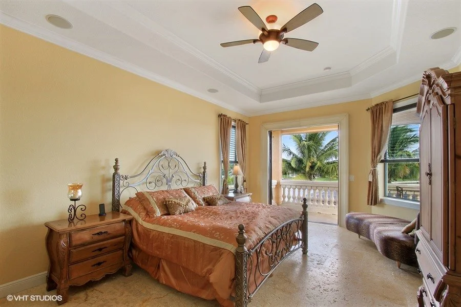 10_1930-SE-21st-Ter_14_Master-Suite-with-balcony-over-looking-pool-wate_Web.jpg