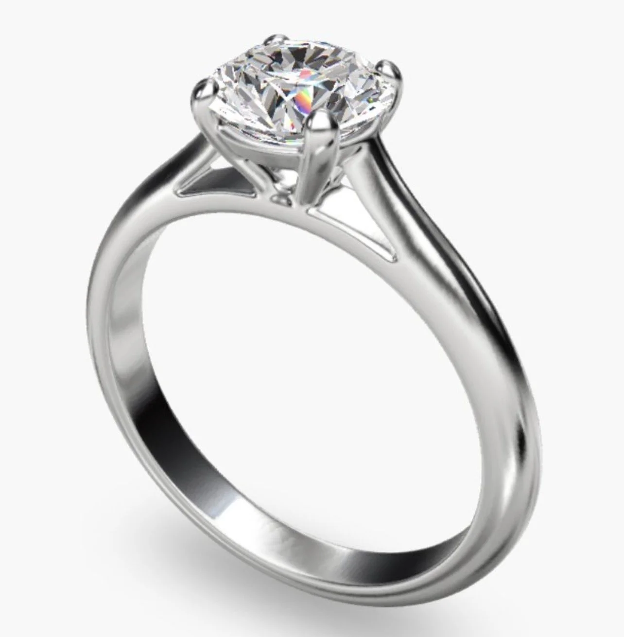 Close-up of a silver engagement ring with a large round diamond in a prong setting.