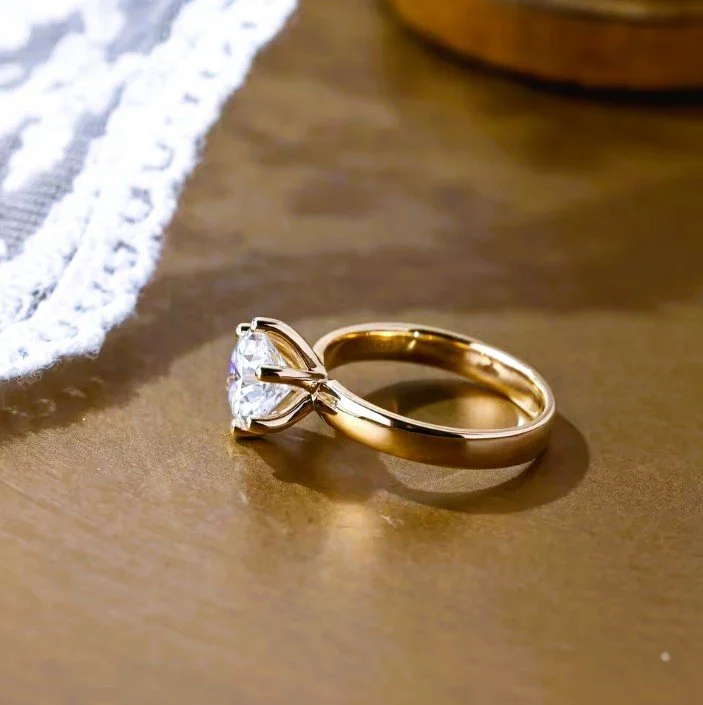 wide 14k gold band round cut diamond solitaire engagement ring from Mr Jeweler side view.jpg