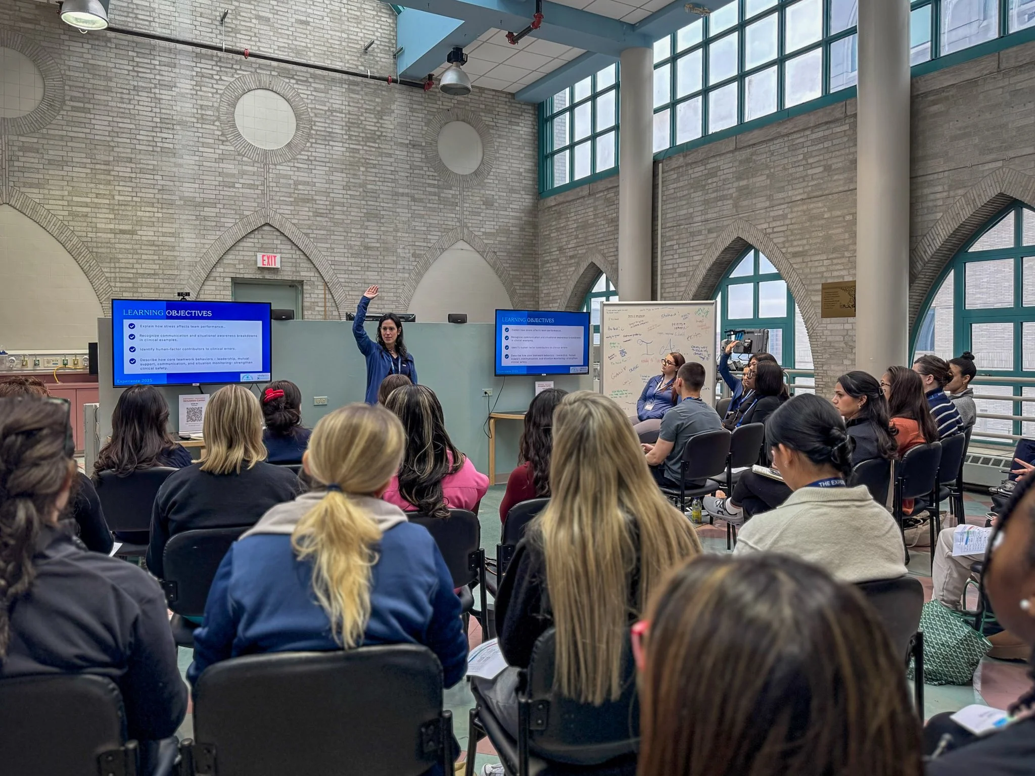 An instructor leads a session on clinical teamwork and communication during the Confident Care Experience.