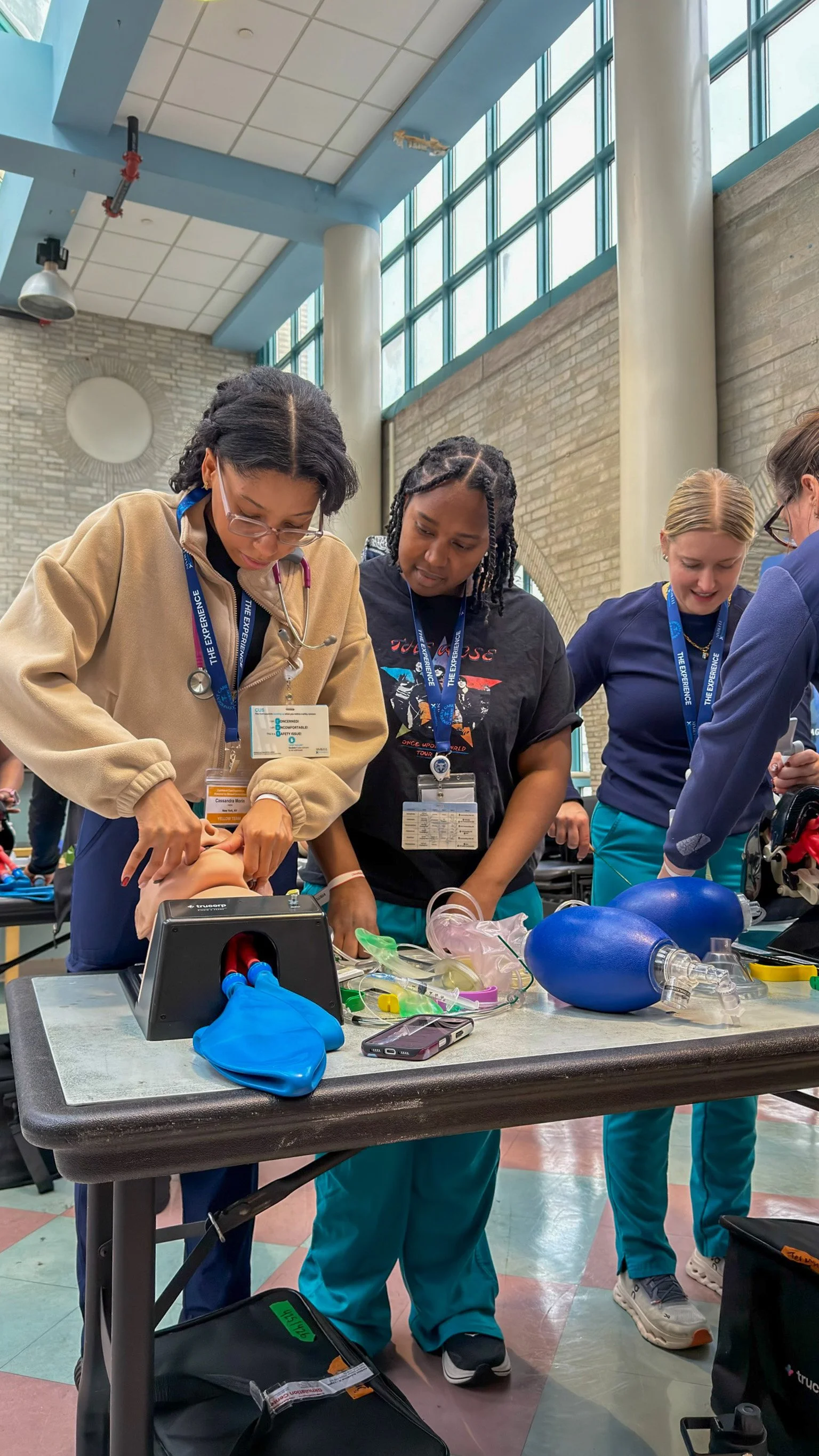 ICU nurses practice airway management and bag-valve-mask skills during a hands-on simulation training session.