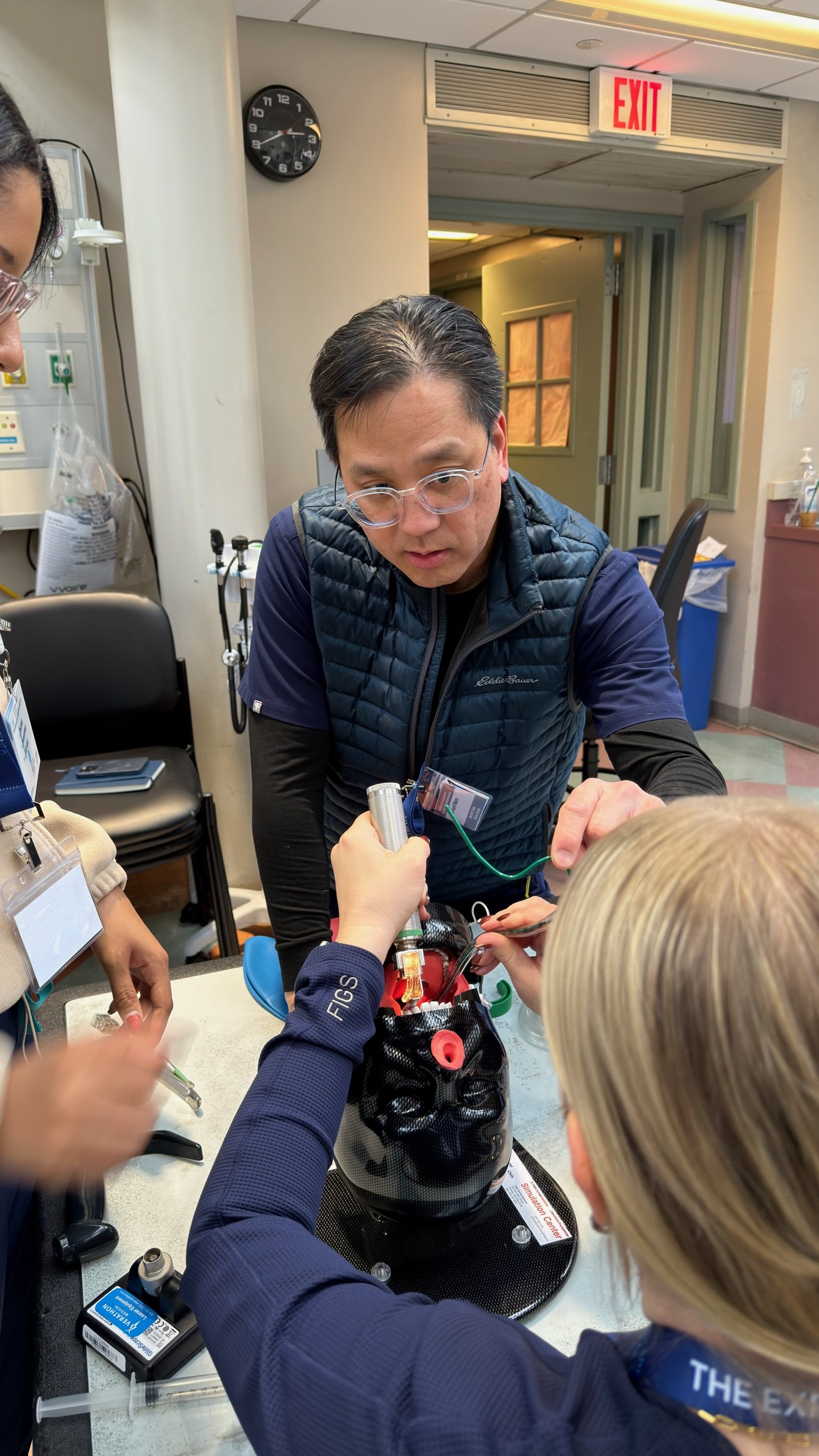 Participants work through a medication management simulation station during the Confident Care Experience.