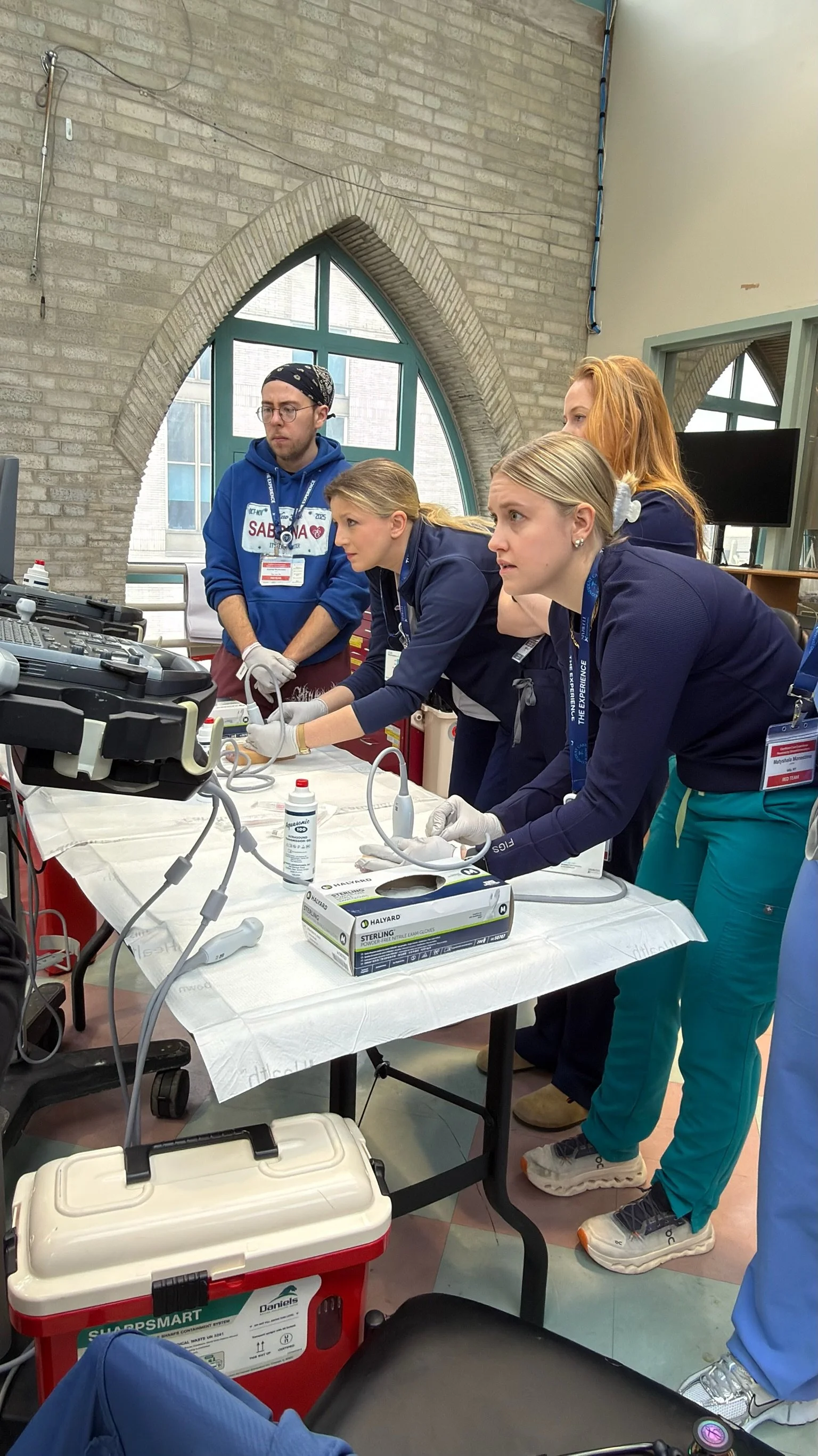 Nurses practice ultrasound-guided vascular access techniques together at the Confident Care Experience.