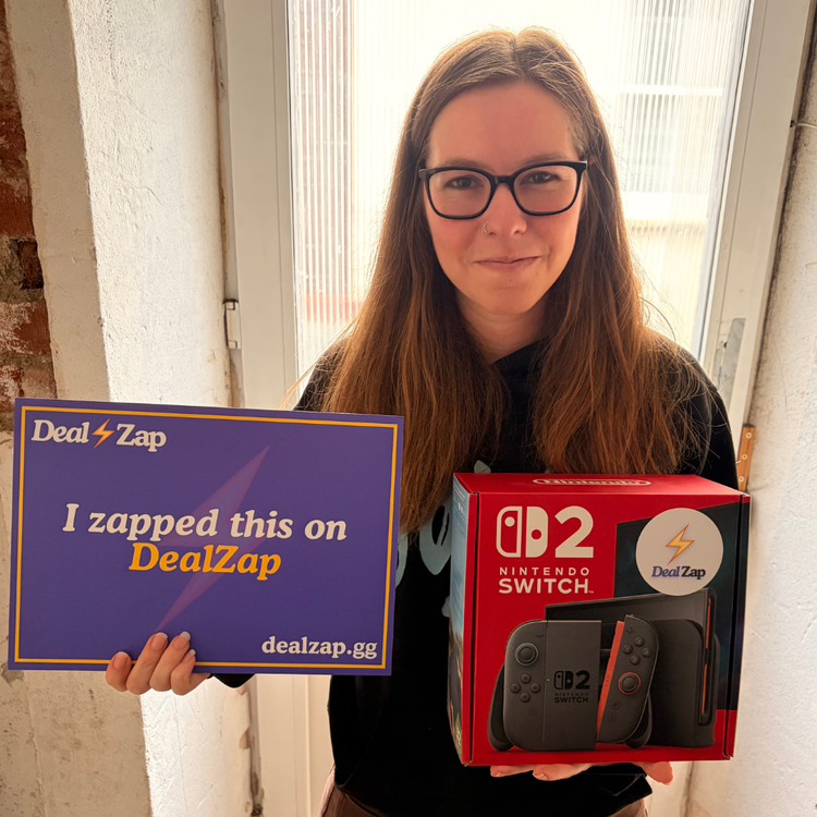 DealZap winner holding a Nintendo Switch 2 and an 'I zapped this on DealZap' sign