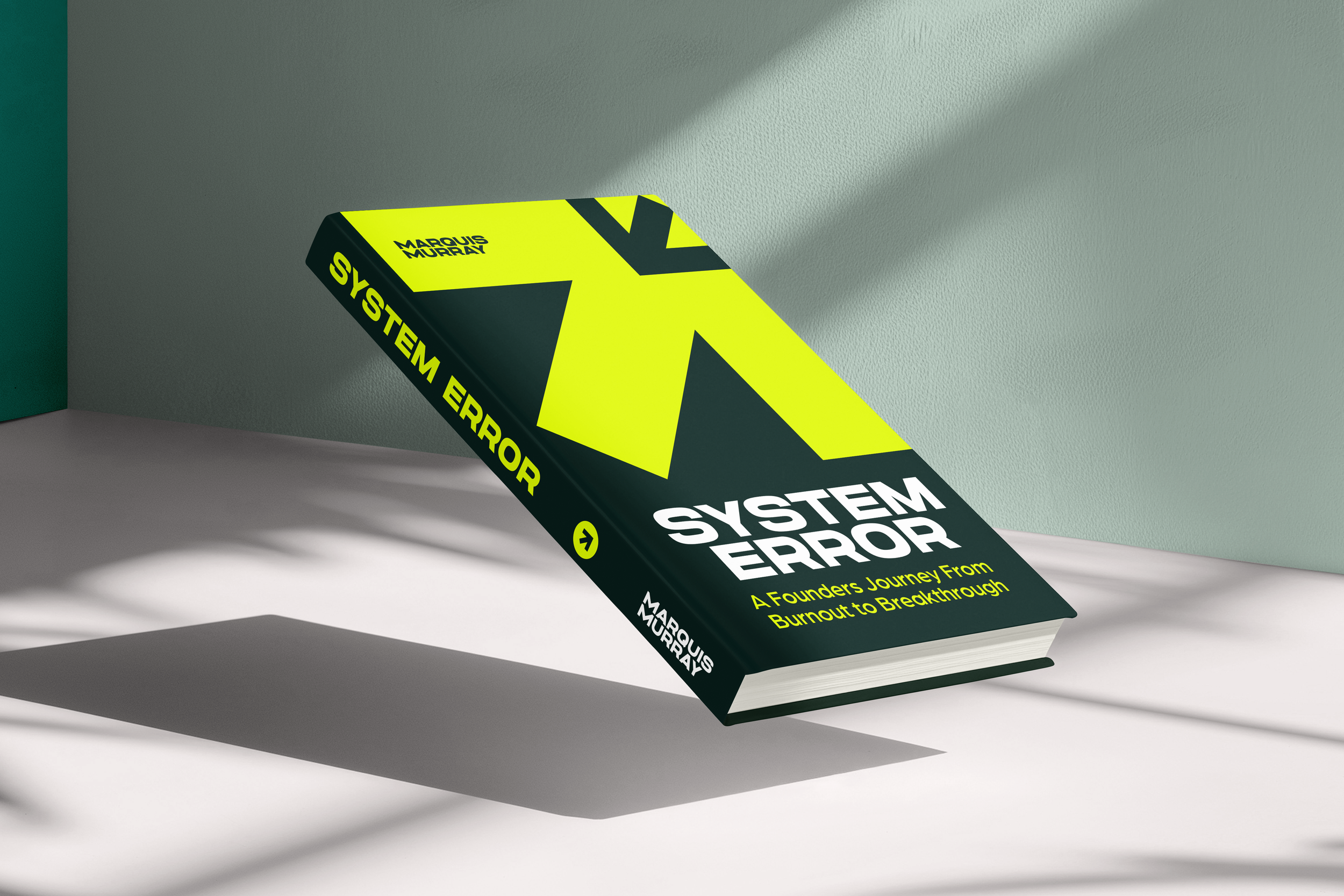 A book titled "System Error" by Marquis Murray lies on a surface, casting a shadow, with a plain wall background.