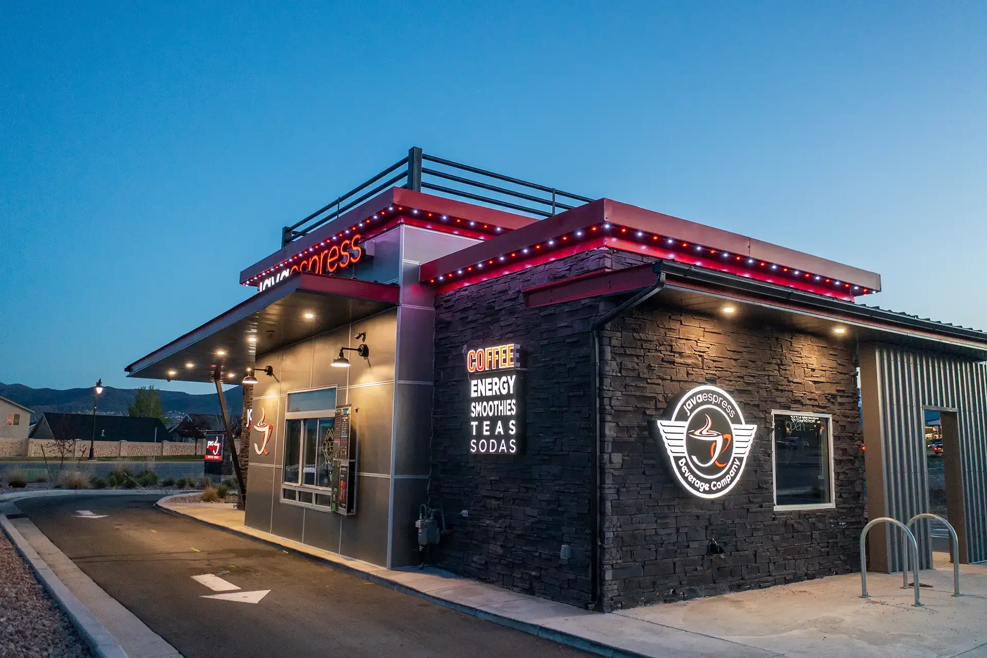 A modern coffee shop with neon signs and JellyFish Eave lights.