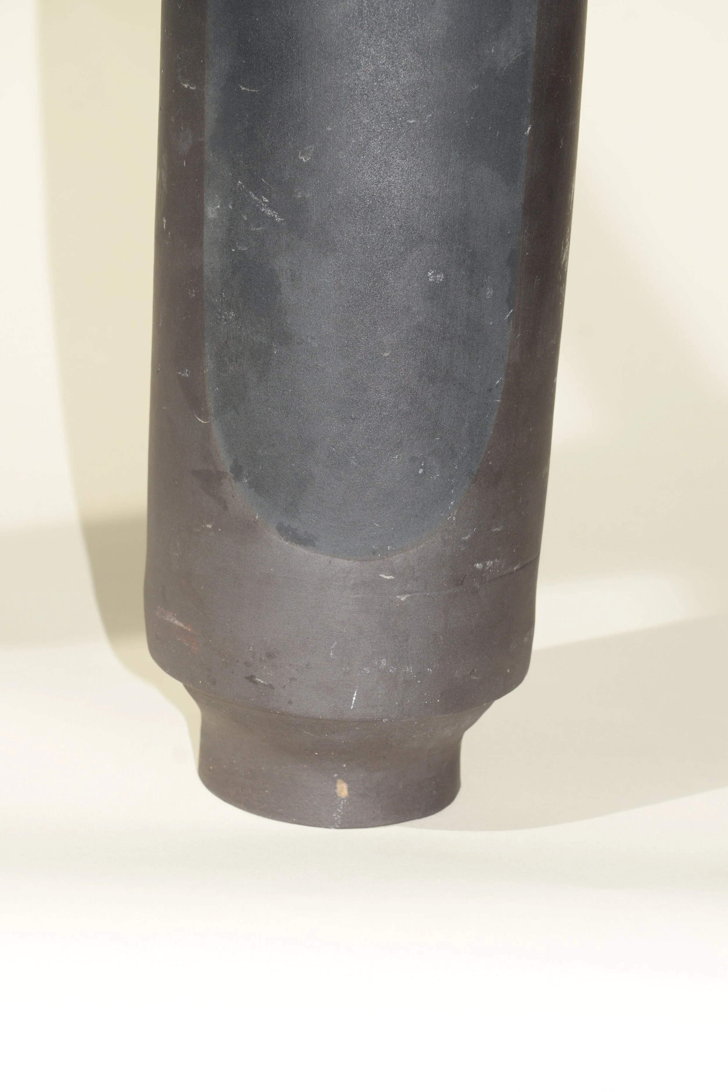 Tall Rolled Metal Vessel