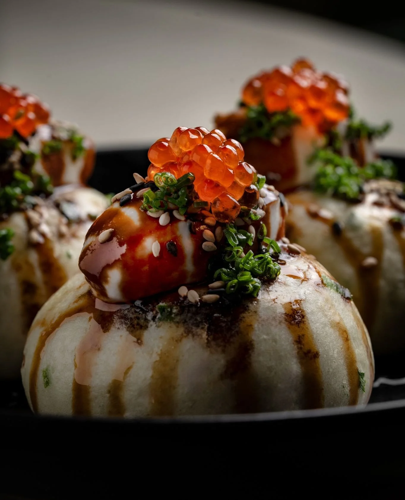 Everything is better in threes. Our Mantou buns, soft and warm, finished with cr&egrave;me and trout roe.