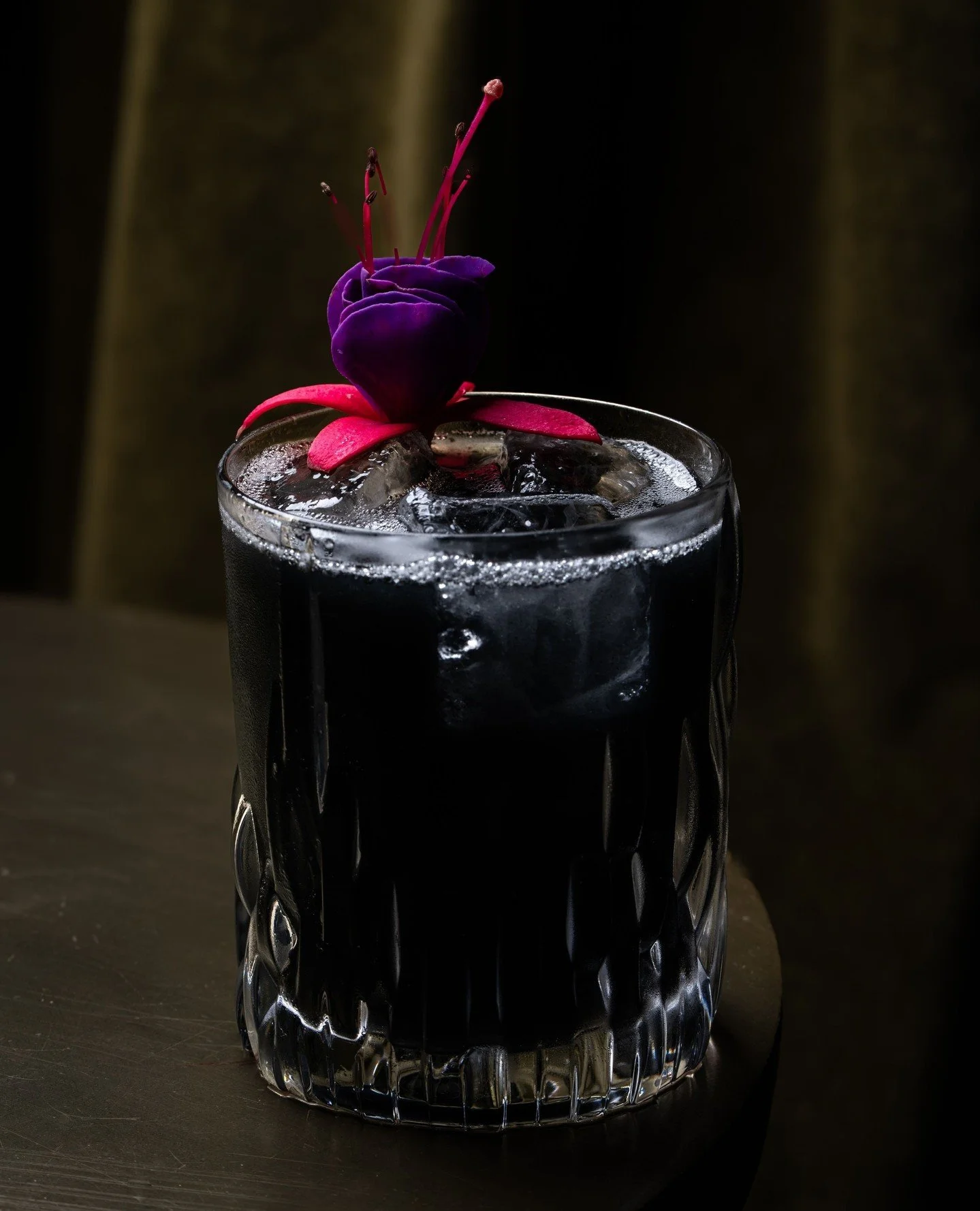 Houston, we have a drink.🚀 Moontricks with aged rum, arrack, spiced lime liqueur, pineapple,⁠ and charcoal.
