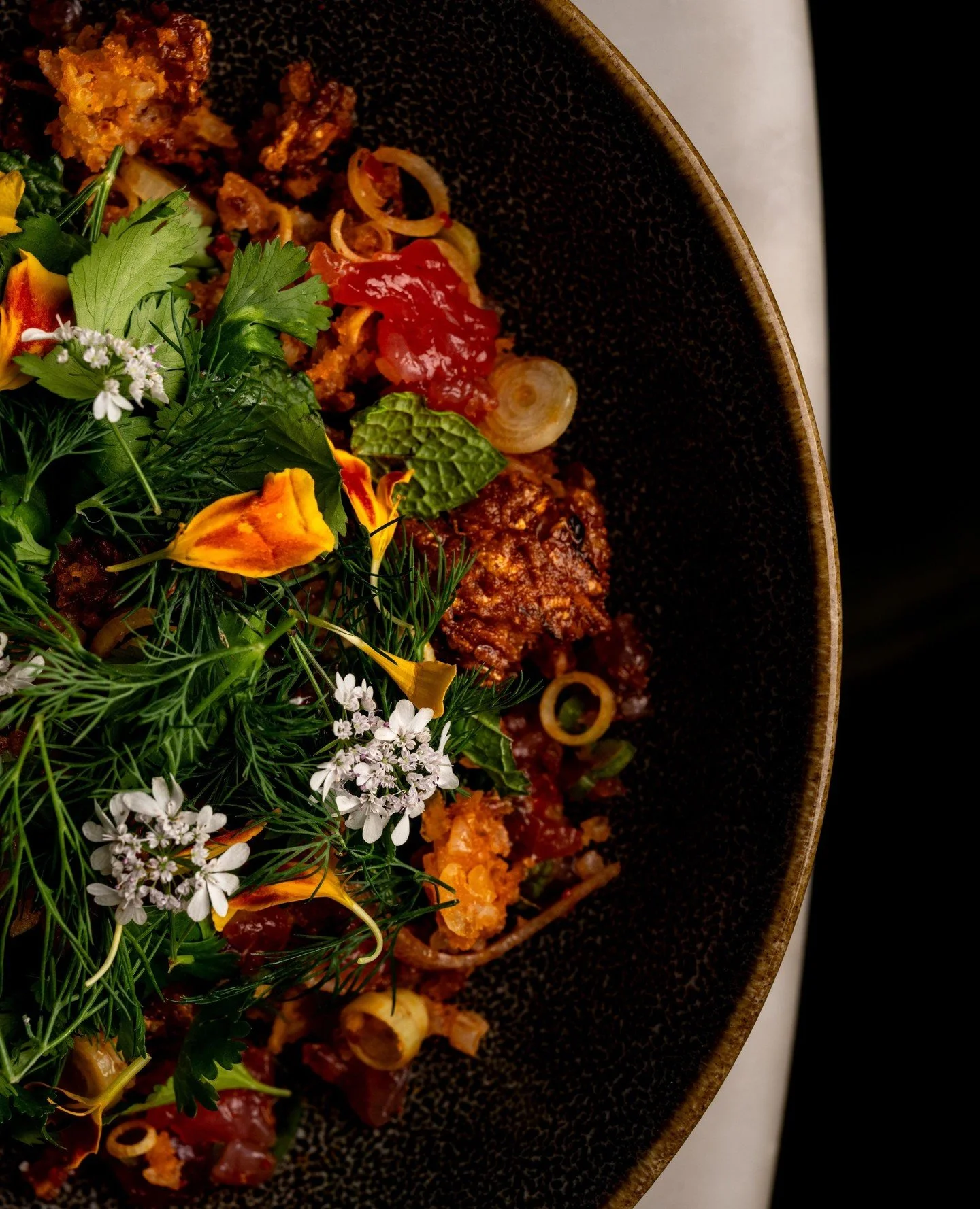 Just when you thought Crispy Rice couldn't get better. Tuna Nam Khao with curry crispy rice, lime leaf, herbs, and coconut.