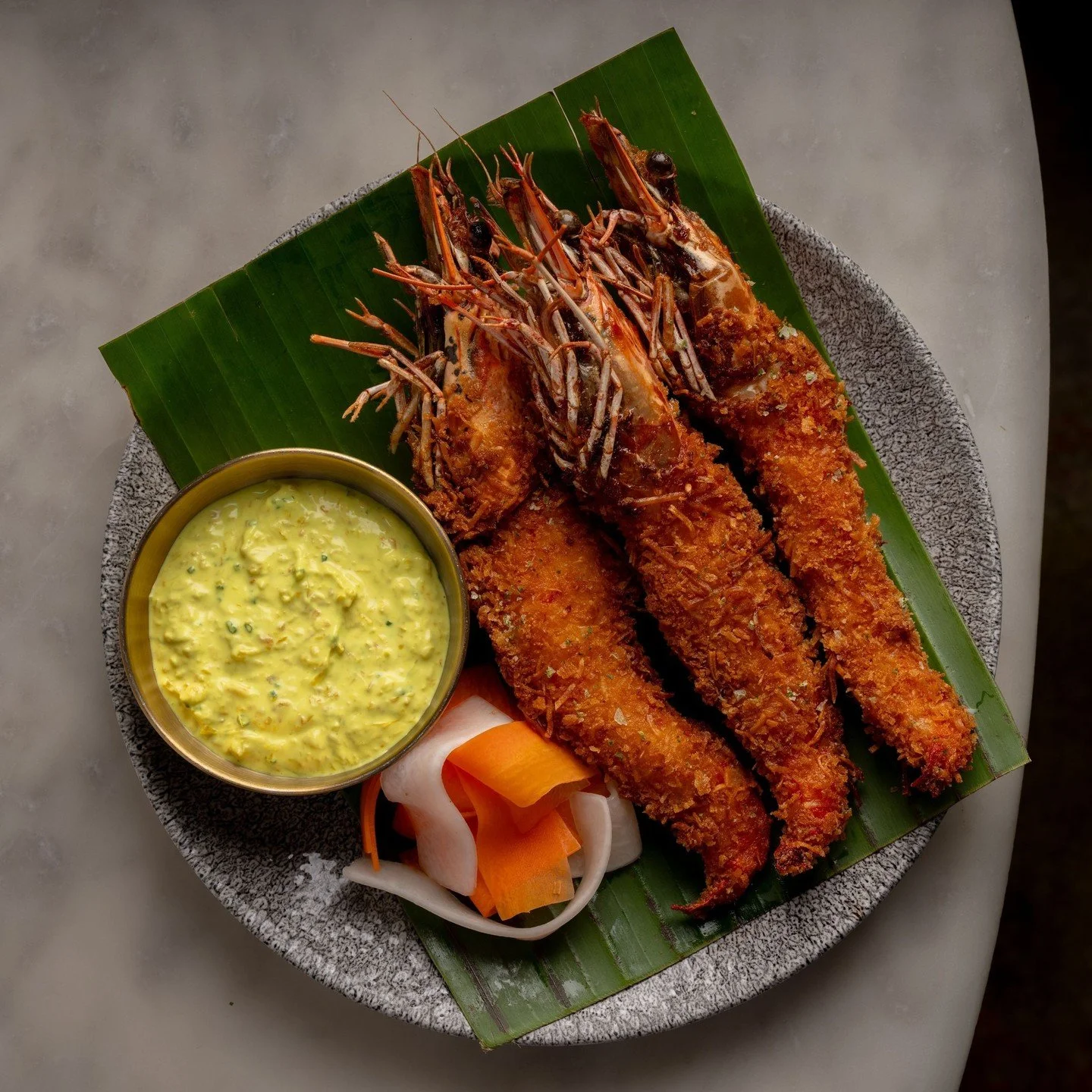 Chef Sara's Coconut Prawns, inspired by a classic. Served with palapa ranch, a Filipino sauce of scallions, ginger, turmeric, thai chili &amp; coconut, and pickled carrots and daikon for that perfect hit of freshness and acidity.
