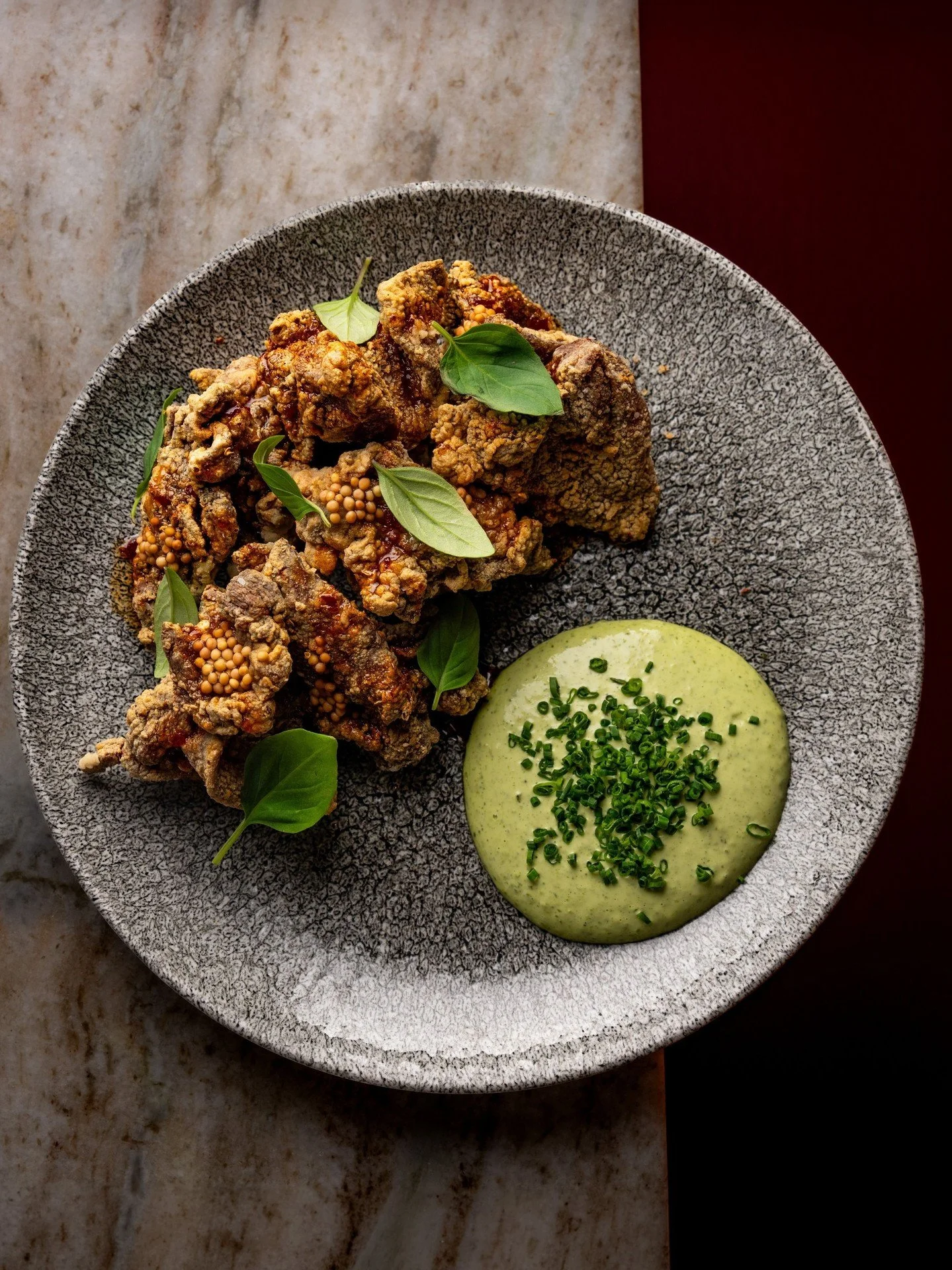 Crispy, golden-fried Jidori chicken tossed in a Szechuan peppercorn spice blend for a little heat. Our Taiwanese Chicken is served with hot honey, Thai basil aioli, and pickled mustard seeds.
