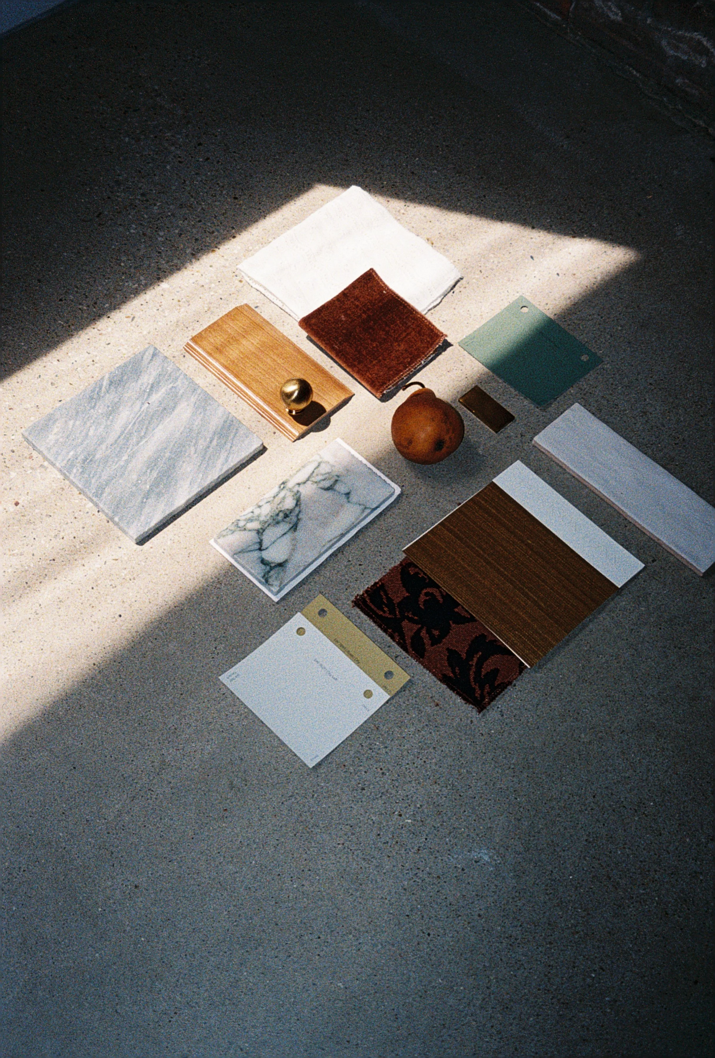 Curated interior design material and finish selections by Texturious Designs in Des Moines, Iowa, featuring wood, stone, tile, and color samples.