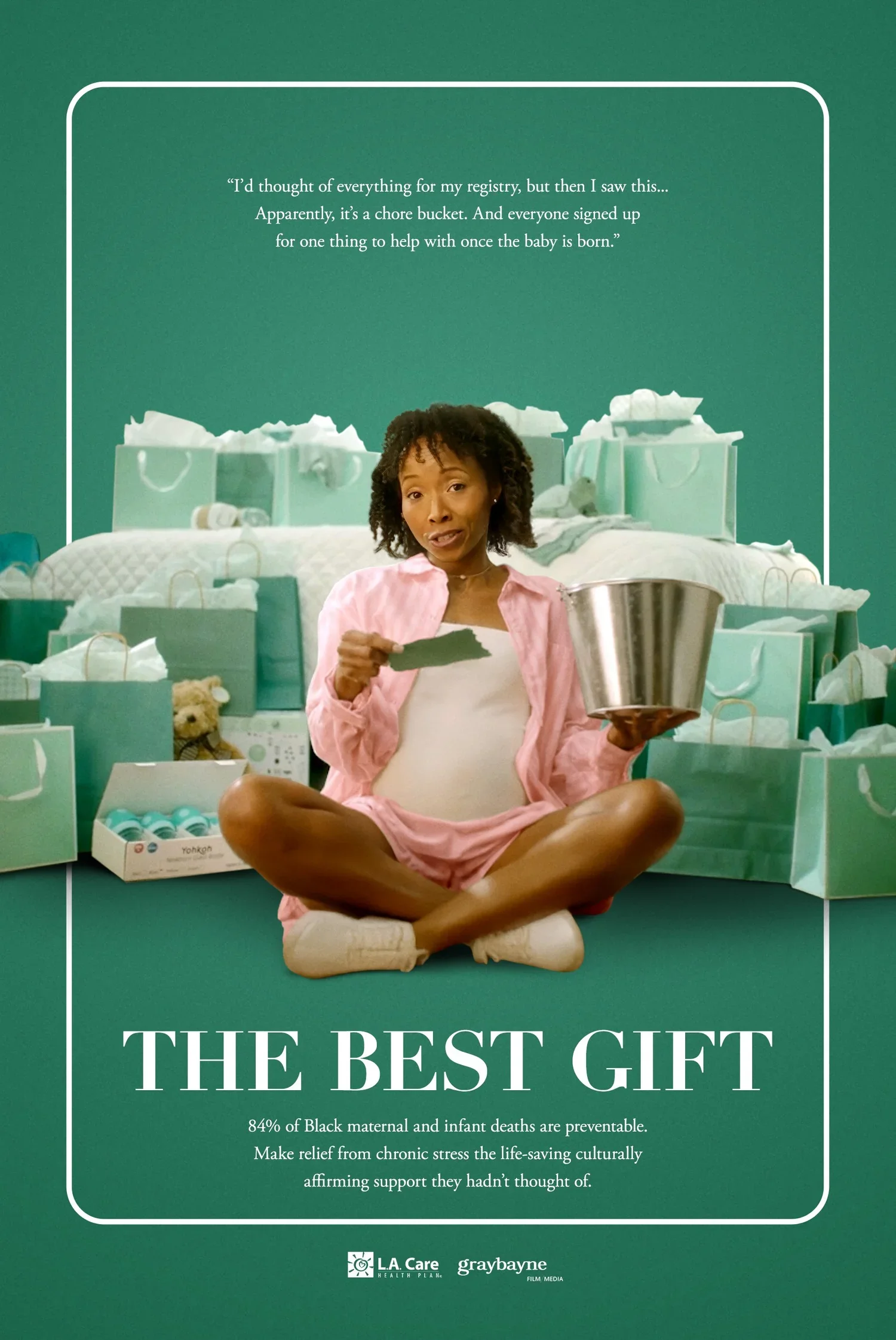 A woman sits cross-legged on the floor, holding a metal bucket and a piece of paper, surrounded by many gift bags and boxes. The background has text about the importance of support for Black maternal and infant health, highlighting that 84% of deaths are preventable, with the title 'The Best Gift.'