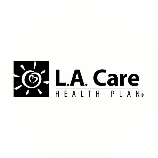 L.A. Care Health Plan logo featuring a smiling sun with a heart inside a square, and the text 'L.A. Care' with 'Health Plan' underneath.